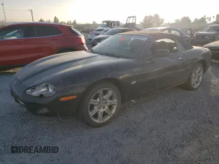 1999 Jaguar XK with VIN SAJGX2041XC039330, listed as a Copart auction lot 82920564 with Not Provided miles and Clean Title. Bid and sale history available at DreamBid. Image 1.