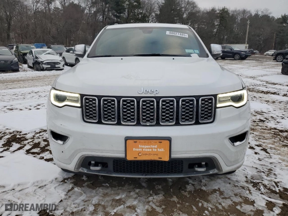2021 Jeep Grand Cherokee Overland with VIN 1C4RJFCG1MC670340, listed as a Copart auction lot 88027485 with 59,472 mi miles and Salvage Title. Bid and sale history available at carsss.com. Image 5.