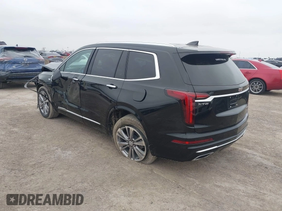 2023 Cadillac XT6 FWD Premium Luxury with VIN 1GYKPCRS8PZ231089, listed as a IAAI auction lot 41500954 with 36,455 mi miles and . Bid and sale history available at DreamBid. Image 3.