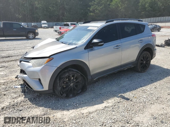 2018 Toyota RAV4 XLE with VIN 2T3WFREVXJW427748, listed as a Copart auction lot 61833055 with 104,057 mi miles and Salvage title. Bid and sale history available at DreamBid. Image 1.