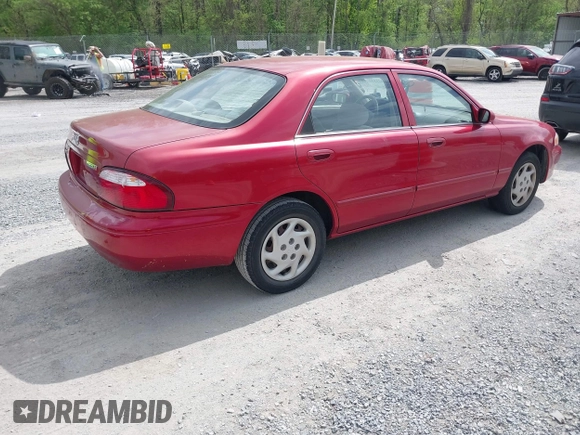 2000 Mazda 626 LX with VIN 1YVGF22C8Y5115891, listed as a IAAI auction lot 42121137 with 186,165 mi miles. Bid and sale history available at carsss.com. Image 4.