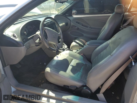 1999 Ford Mustang with VIN 1FAFP4448XF233101, listed as a Copart auction lot 54701005 with 54,585 mi miles and Salvage title. Bid and sale history available at DreamBid. Image 7.