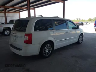 2014 Chrysler Town & Country Touring-L with VIN 2C4RC1CG2ER312444, listed as a IAAI auction lot 42050774 with 124,010 mi miles. Bid and sale history available at carsss.com. Image 4.