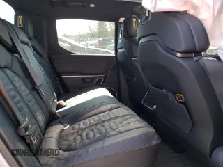 2023 Rivian R1T Adventure with VIN 7FCTGBAA8PN027711, listed as a Copart auction lot 49449155 with 16,031 mi miles and Salvage Title. Bid and sale history available at carsss.com. Image 10.