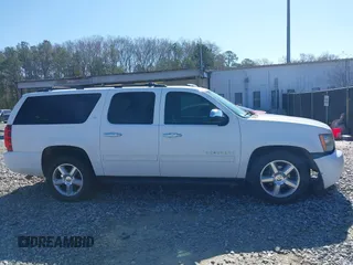 2011 Chevrolet Suburban LT with VIN 1GNSCJE05BR357775, listed as a IAAI auction lot 41807667 with 327,313 mi miles. Bid and sale history available at carsss.com. Image 13.