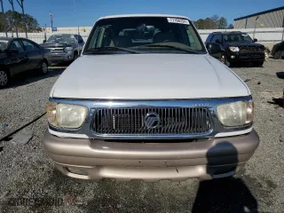 2000 Mercury Mountaineer with VIN 4M2ZU66P8YUJ40296, listed as a Copart auction lot 77108224 with 215,850 mi miles and Salvage Title. Bid and sale history available at carsss.com. Image 5.