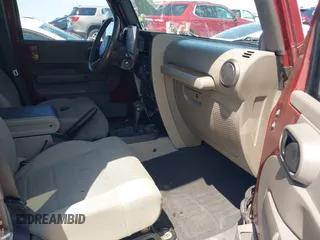 2007 Jeep Wrangler Unlimited Sahara with VIN 1J4GA59187L116585, listed as a IAAI auction lot 41996297 with 151,961 mi miles and . Bid and sale history available at DreamBid. Image 5.