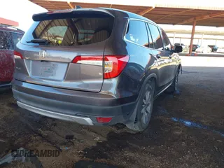 2020 Honda Pilot EX-L with VIN 5FNYF5H50LB011021, listed as a IAAI auction lot 41382249 with 113,884 mi miles. Bid and sale history available at carsss.com. Image 4.