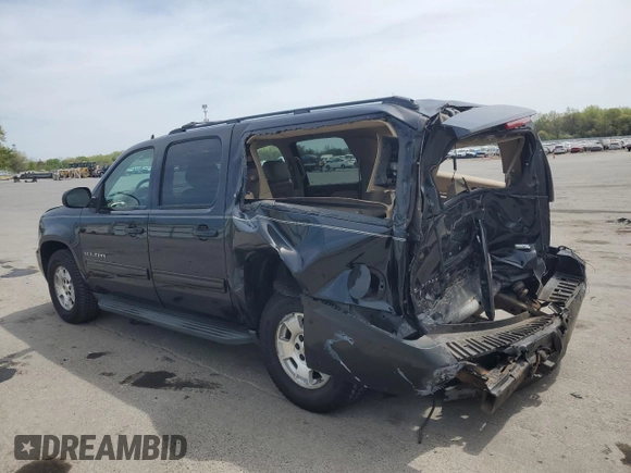 2012 Chevrolet Suburban LT with VIN 1GNSKJE77CR298049, listed as a Copart auction lot 61171865 with 247,737 mi miles and Salvage title. Bid and sale history available at DreamBid. Image 2.