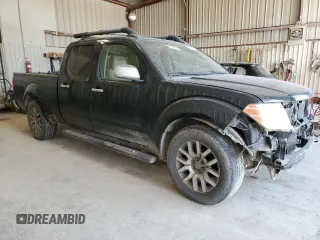2009 Nissan Frontier LE with VIN 1N6AD09U79C409698, listed as a Copart auction lot 55843545 with 230,334 mi miles and Salvage title. Bid and sale history available at DreamBid. Image 4.