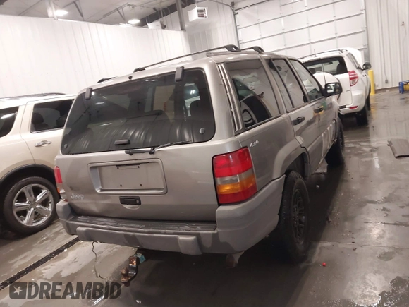 1998 Jeep Grand Cherokee Laredo with VIN 1J4GZ58S3WC343555, listed as a IAAI auction lot 41528943 with 219,146 mi miles. Bid and sale history available at carsss.com. Image 17.