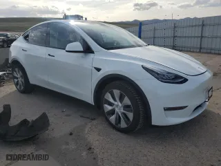 2021 Tesla Model Y Long Range with VIN 5YJYGDEEXMF299515, listed as a Copart auction lot 51978555 with 30,459 mi miles and Salvage Title. Bid and sale history available at carsss.com. Image 4.