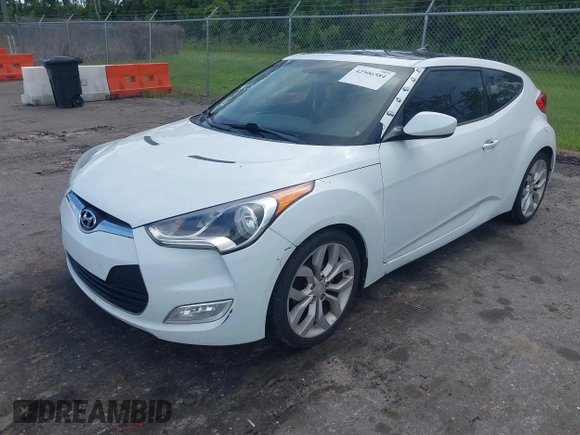 2012 Hyundai Veloster w/Gray Int z VIN KMHTC6ADXCU050034, wystawiony jako IAAI lot #42506584 z przebiegiem 142 514 mil mil oraz . Historia ofert i sprzedaży dostępna na DreamBid. Obrazek 6.