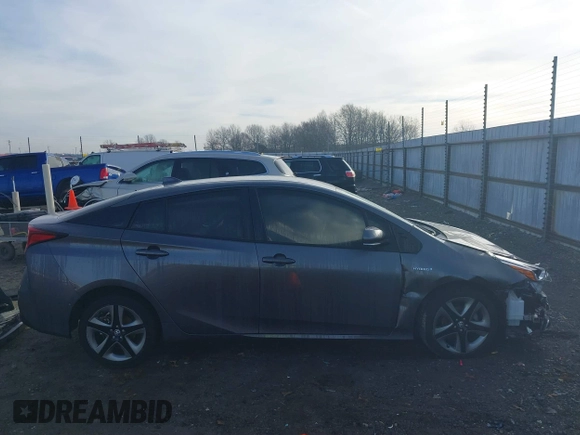 2021 Toyota Prius L Eco z VIN JTDKAMFU1M3149965, wystawiony jako IAAI lot #38641916 z przebiegiem 69 942 mil mil oraz . Historia ofert i sprzedaży dostępna na DreamBid. Obrazek 14.