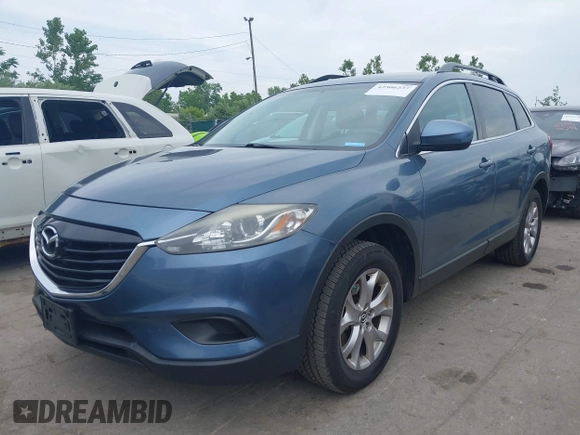 2015 Mazda CX-9 Touring with VIN JM3TB3CV9F0463819, listed as a IAAI auction lot 42506237 with 207,418 mi miles and . Bid and sale history available at DreamBid. Image 2.