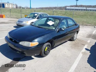 1999 Ford Escort LX with VIN 1FAFP10P3XW287792, listed as a IAAI auction lot 41807938 with 247,141 mi miles. Bid and sale history available at carsss.com. Image 2.