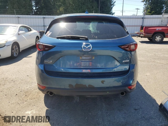 2018 Mazda CX-5 Touring z VIN JM3KFBCM2J1363310, wystawiony jako Copart lot #58969135 z przebiegiem 86 831 mil mil oraz Szkoda całkowita • Salvage title. Historia ofert i sprzedaży dostępna na DreamBid. Obrazek 6.