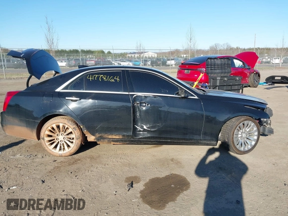 2019 Cadillac CTS Luxury AWD z VIN 1G6AX5SX8K0129858, wystawiony jako IAAI lot #41778164 z przebiegiem 89 695 mil mil oraz . Historia ofert i sprzedaży dostępna na DreamBid. Obrazek 13.