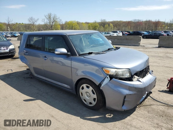 2012 Scion xB with VIN JTLZE4FE7CJ030408, listed as a Copart auction lot 54153195 with 198,649 mi miles and Salvage Title. Bid and sale history available at DreamBid. Image 4.