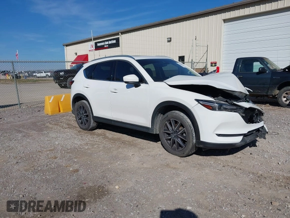 2018 Mazda CX-5 Grand Touring with VIN JM3KFADM0J0377026, listed as a IAAI auction lot 41649686 with 100,901 mi miles and . Bid and sale history available at DreamBid. Image 1.