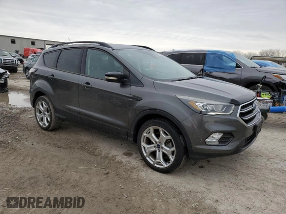 2017 Ford Escape Titanium with VIN 1FMCU9J99HUB79870, listed as a Copart auction lot 47469655 with 58,683 mi miles and Salvage Title. Bid and sale history available at carsss.com. Image 4.