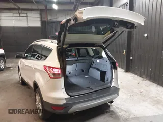2016 Ford Escape Titanium with VIN 1FMCU9J94GUB02810, listed as a IAAI auction lot 41643907 with 119,684 mi miles. Bid and sale history available at carsss.com. Image 3.