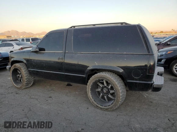 1999 Chevrolet Tahoe with VIN 3GNEC18R1XG143882, listed as a Copart auction lot 42177005 with 130,368 mi miles and Salvage title. Bid and sale history available at DreamBid. Image 2.