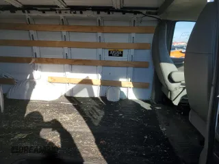 2014 GMC Savana Cargo Van with VIN 1GTW7FCAXE1909748, listed as a Copart auction lot 87214754 with 263,944 mi miles and Salvage Title. Bid and sale history available at carsss.com. Image 10.
