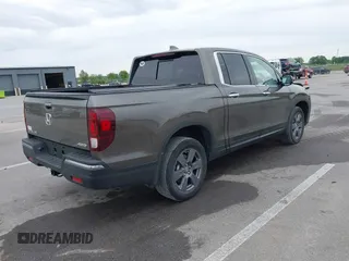 2020 Honda Ridgeline RTL-E with VIN 5FPYK3F78LB001882, listed as a IAAI auction lot 42352980 with 63,278 mi miles and . Bid and sale history available at DreamBid. Image 4.