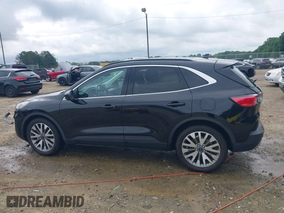 2021 Ford Escape Titanium Hybrid z VIN 1FMCU0DZ0MUA16798, wystawiony jako IAAI lot #42502086 z przebiegiem 107 250 mil mil oraz . Historia ofert i sprzedaży dostępna na DreamBid. Obrazek 14.