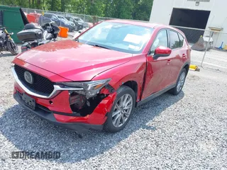 2021 Mazda CX-5 Grand Touring with VIN JM3KFBDM3M0434569, listed as a IAAI auction lot 42422349 with 25,924 mi miles and . Bid and sale history available at DreamBid. Image 17.