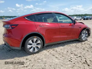 2024 Tesla Model Y Long Range with VIN 7SAYGDEE5RA235910, listed as a Copart auction lot 60988605 with 23,882 mi miles and Salvage title. Bid and sale history available at DreamBid. Image 3.