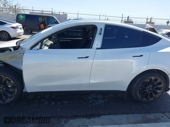 2023 Tesla Model Y Long Range with VIN 7SAYGDEEXPA129790, listed as a IAAI auction lot 41735721 with 20,402 mi miles and . Bid and sale history available at DreamBid. Image 15.