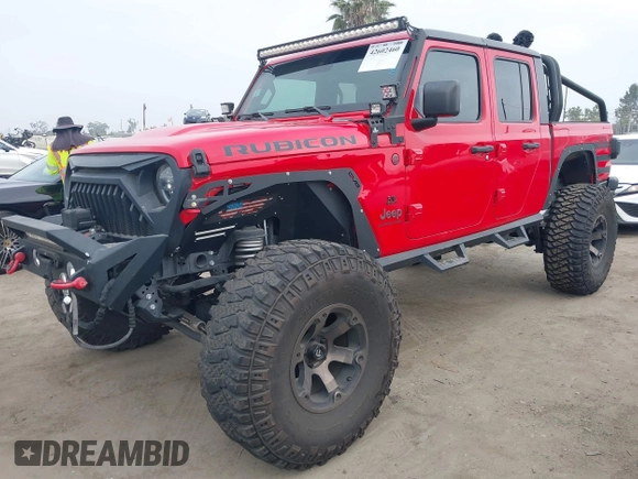 2020 Jeep Gladiator Rubicon with VIN 1C6JJTBG4LL178260, listed as a IAAI auction lot 42602460 with 61,899 mi miles and . Bid and sale history available at DreamBid. Image 18.