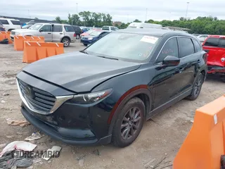 2021 Mazda CX-9 Sport with VIN JM3TCABY6M0522352, listed as a IAAI auction lot 42613136 with 106,167 mi miles and . Bid and sale history available at DreamBid. Image 17.