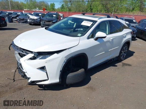 2019 Lexus RX 350 with VIN JTJBZMCA0K2041419, listed as a IAAI auction lot 42128084 with 98,994 mi miles and . Bid and sale history available at DreamBid. Image 2.