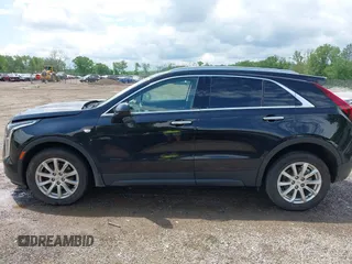 2019 Cadillac XT4 AWD Luxury z VIN 1GYFZBR41KF150209, wystawiony jako IAAI lot #42325529 z przebiegiem 76 828 mil mil oraz . Historia ofert i sprzedaży dostępna na DreamBid. Obrazek 14.