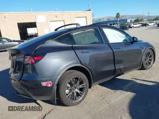 2024 Tesla Model Y Long Range with VIN 7SAYGAEE7RF126351, listed as a IAAI auction lot 41282973 with 5,919 mi miles. Bid and sale history available at carsss.com. Image 4.