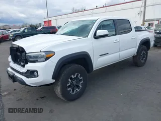 2023 Toyota Tacoma SR z VIN 3TMCZ5AN0PM541700, wystawiony jako IAAI lot #41819408 z przebiegiem 14 216 mil mil oraz . Historia ofert i sprzedaży dostępna na DreamBid. Obrazek 18.