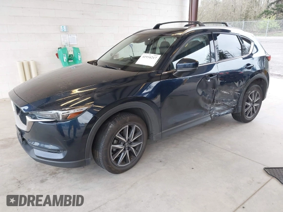2018 Mazda CX-5 Grand Touring with VIN JM3KFBDM4J0302870, listed as a IAAI auction lot 41934217 with 57,151 mi miles. Bid and sale history available at carsss.com. Image 18.