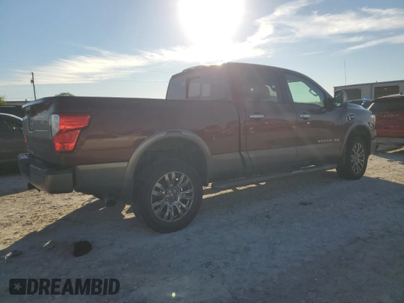 2016 Nissan Titan Platinum Reserve z VIN 1N6BA1F2XGN506885, wystawiony jako Copart lot #80171524 z przebiegiem 318 311 mil mil oraz Czysty tytuł • Clean title. Historia ofert i sprzedaży dostępna na DreamBid. Obrazek 3.
