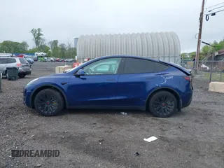 2023 Tesla Model Y Long Range z VIN 7SAYGDEE6PF603981, wystawiony jako IAAI lot #42133348 z przebiegiem 28 566 mil mil oraz . Historia ofert i sprzedaży dostępna na DreamBid. Obrazek 15.