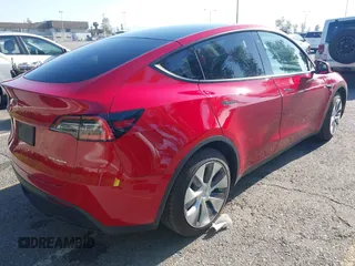 2020 Tesla Model Y Long Range with VIN 5YJYGDEE8LF057014, listed as a IAAI auction lot 41988113 with 18,246 mi miles and . Bid and sale history available at DreamBid. Image 4.