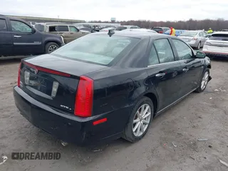 2009 Cadillac STS AWD z VIN 1G6DD67V290140111, wystawiony jako IAAI lot #41800236 z przebiegiem 81 913 mil mil oraz . Historia ofert i sprzedaży dostępna na DreamBid. Obrazek 4.
