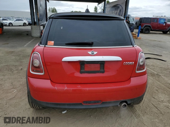 2009 MINI Hardtop with VIN WMWMF33519TW77558, listed as a Copart auction lot 54556785 with 97,749 mi miles and Salvage Title. Bid and sale history available at DreamBid. Image 6.