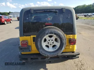 2000 Jeep Wrangler Sport with VIN 1J4FA49SXYP745676, listed as a Copart auction lot 63096755 with 147,226 mi miles and Salvage title. Bid and sale history available at DreamBid. Image 6.