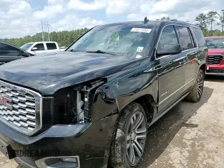 2019 GMC Yukon Denali with VIN 1GKS1CKJ0KR259491, listed as a Copart auction lot 51071335 with 105,294 mi miles and Salvage Title. Bid and sale history available at carsss.com. Image 12.