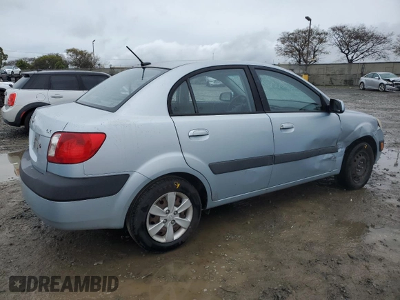 2009 Kia Rio LX with VIN KNADE223396443465, listed as a Copart auction lot 51370975 with 110,952 mi miles and Salvage Title. Bid and sale history available at carsss.com. Image 3.