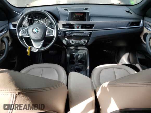 2017 BMW X1 xDrive28i with VIN WBXHT3C32H5F71690, listed as a Copart auction lot 60852375 with 67,475 mi miles and Salvage title. Bid and sale history available at DreamBid. Image 8.