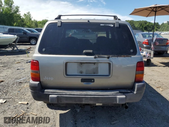 1998 Jeep Grand Cherokee Laredo z VIN 1J4GZ58S4WC278490, wystawiony jako Copart lot #62388535 z przebiegiem 133 896 mil mil oraz Czysty tytuł • Clean title. Historia ofert i sprzedaży dostępna na DreamBid. Obrazek 6.